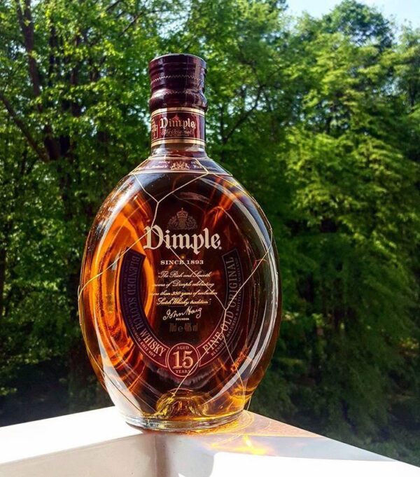 Discover the smooth taste of Dimple Pinch Scotch Whisky. Aged 15 years, this premium blend delivers rich flavor and refined quality in every sip