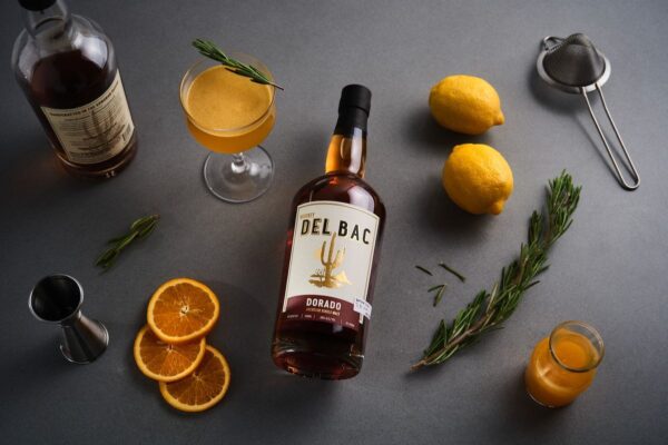 Buy Whiskey Del Bac Dorado, a bold mesquite-smoked American single malt whiskey. Explore rich notes of spice, oak, and caramel.