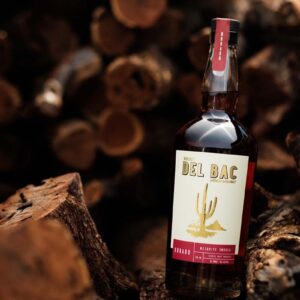 Buy Whiskey Del Bac Dorado, a bold mesquite-smoked American single malt whiskey. Explore rich notes of spice, oak, and caramel.