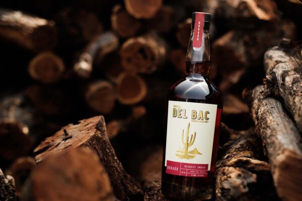 Buy Whiskey Del Bac Dorado, a bold mesquite-smoked American single malt whiskey. Explore rich notes of spice, oak, and caramel.